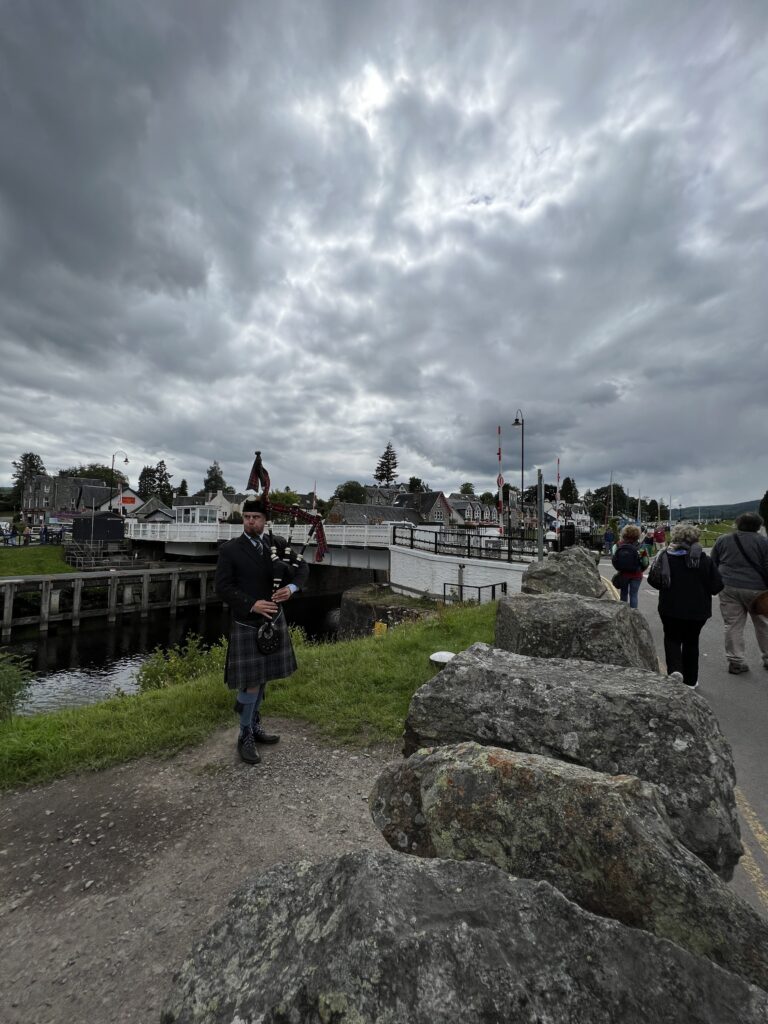 A bagpiper at the Fort Augustus Lock's in Scotland